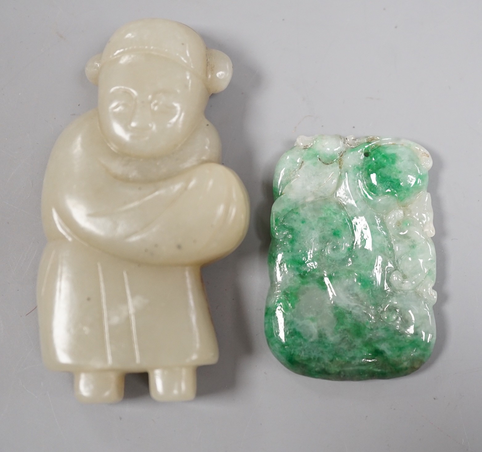 A Chinese celadon jade figure and a jadeite plaque (2)